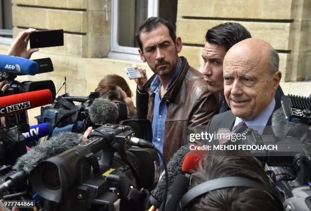 Bordeaux mayor, former French prime minister Alain Juppe speaks to journalists in front of Bordeaux townhall, on June 18, 2018 during a press...