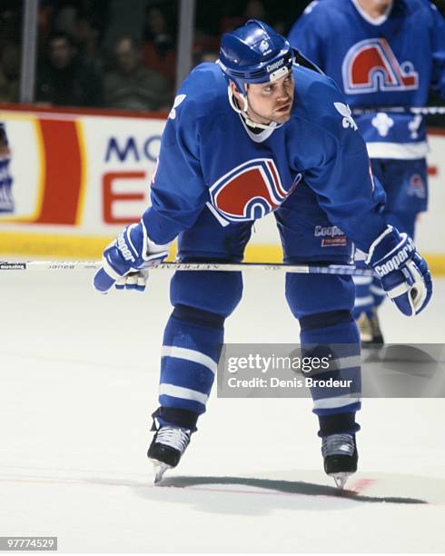 Owen Nolan of the Quebec Nordiques skates against the Montreal Canadiens in the early 1990's at the Montreal Forum in Montreal, Quebec, Canada.