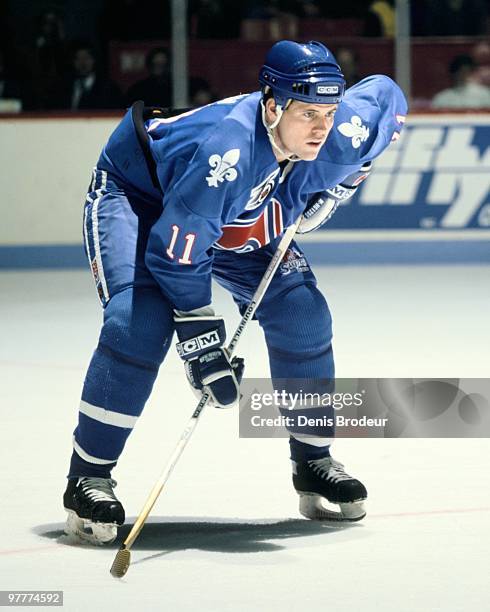 Owen Nolan of the Quebec Nordiques skates against the Montreal Canadiens in the early 1990's at the Montreal Forum in Montreal, Quebec, Canada.