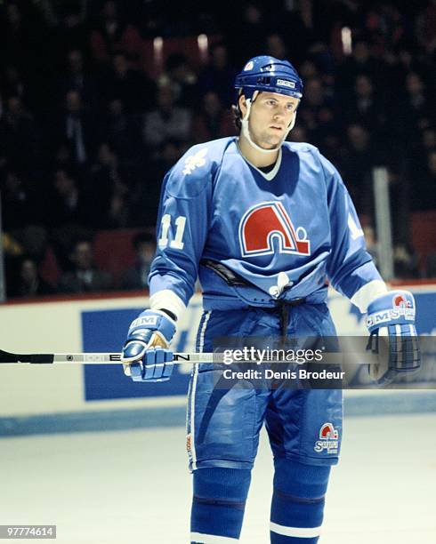 Owen Nolan of the Quebec Nordiques skates against the Montreal Canadiens in the early 1990's at the Montreal Forum in Montreal, Quebec, Canada.