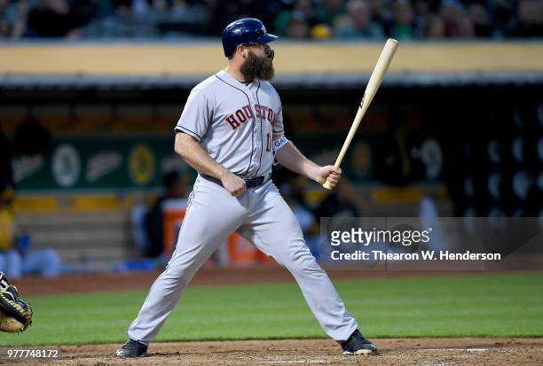 Evan Gattis of the Houston Astros bats against the Oakland Athletics in the top of the fifth inning at the Oakland Alameda Coliseum on June 12, 2018...