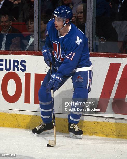 Peter Forsberg of the Quebec Nordiques skates with the puck against the Montreal Canadiens in the mid 1990's at the Montreal Forum in Montreal,...