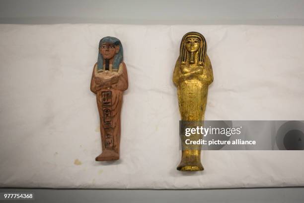 April 2018, Egypt, Giza: Old Egyptian artefacts seen at the preservation laboratory in the Grand Egyptian Museum. The new museum close to the...