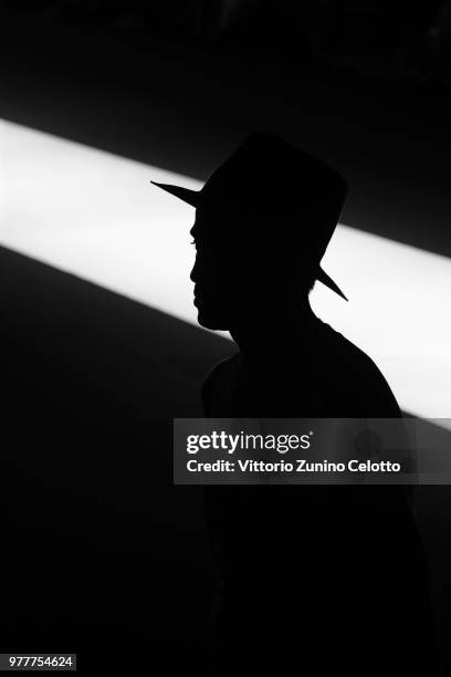 Model walks the runway at the Giorgio Armani show during Milan Men's Fashion Week Spring/Summer 2019 on June 18, 2018 in Milan, Italy.