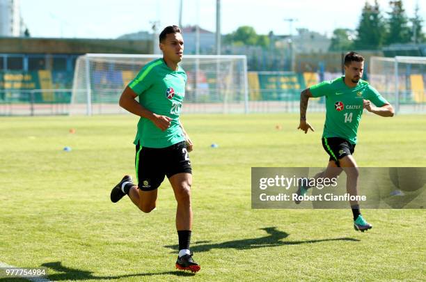 Trent Sainsbury and Jamie MacLaren of Australia run on the pitch during an Australia Socceroos media opportunity at Stadium Trudovye Rezervy on June...