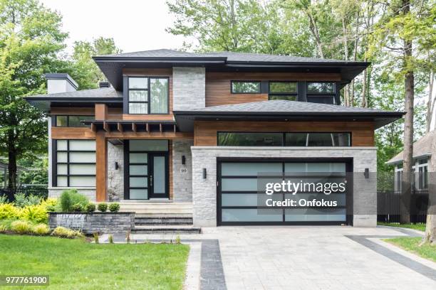 luxury property on sunny day of summer - garage doors imagens e fotografias de stock