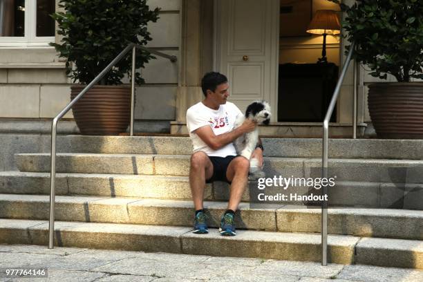 In this handout image provided by Moncloa, Spanish Prime Minister, Pedro Sanchez, is seen with his dog Turca, after jogging on June 18, 2018 in...
