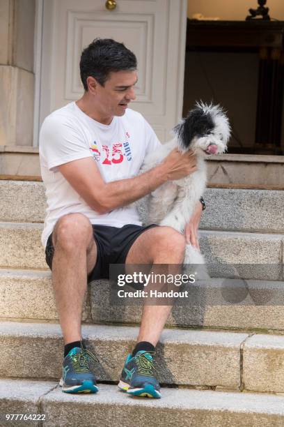 In this handout image provided by Moncloa, Spanish Prime Minister, Pedro Sanchez, is seen with his dog Turca, after jogging on June 18, 2018 in...