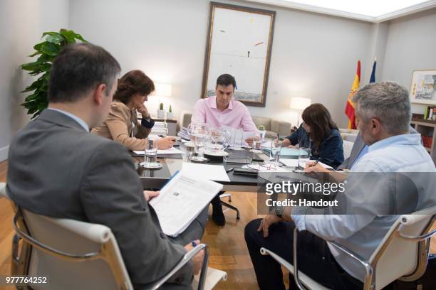 In this handout image provided by Moncloa, Spanish Prime Minister, Pedro Sanchez is seen during a meeting with Deputy Prime Minister, Carmen Calvo...