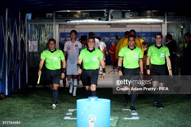 Assistant referee Juan Zumba, referee Joel Aguilar, assistant referee Juan Carlos Mora Araya and fourth official Norbert Hauata walk on the pitch...