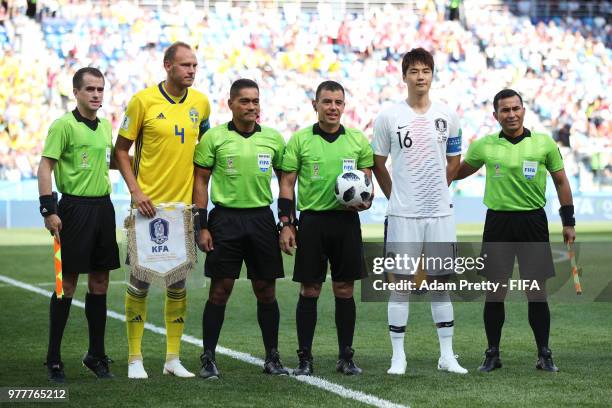 Assistant referee Juan Zumba, Andreas Granqvist of Sweden, fourth official Norbert Hauata, referee Joel Aguilar, Ki Sung-Yueng and assistant referee...