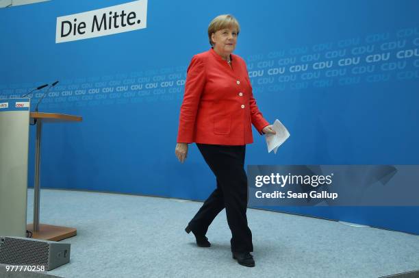 German Chancellor and leader of the German Christian Democrats Angela Merkel departs after speaking to the media following two days of talks amongst...