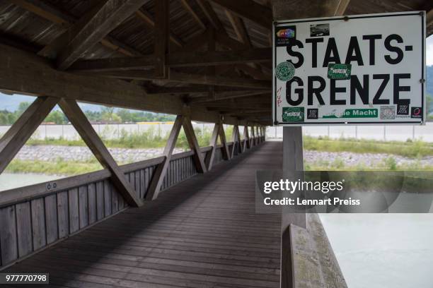 Sign reading 'Staatsgrenze' is seen on a bridge over the river Inn at the German-Austrian border on June 18, 2018 near Reisach, Germany. Two of the...