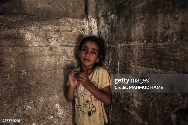 Child cries during the funeral of a 24 year-old Sabri Ahmed Abu Khader in Gaza City on June 18, 2018. Sabri was killed by Israeli fire near the Gaza...