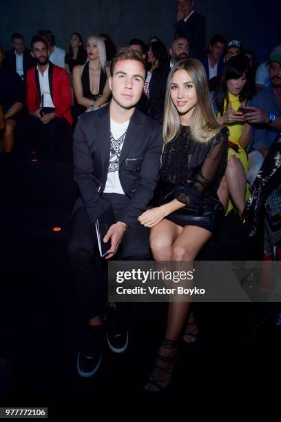 Mario Gotze and Ann-Kathrin Vida attend Dsquared2 show during Milan Men's Fashion Spring/Summer 2019 on June 17, 2018 in Milan, Italy.