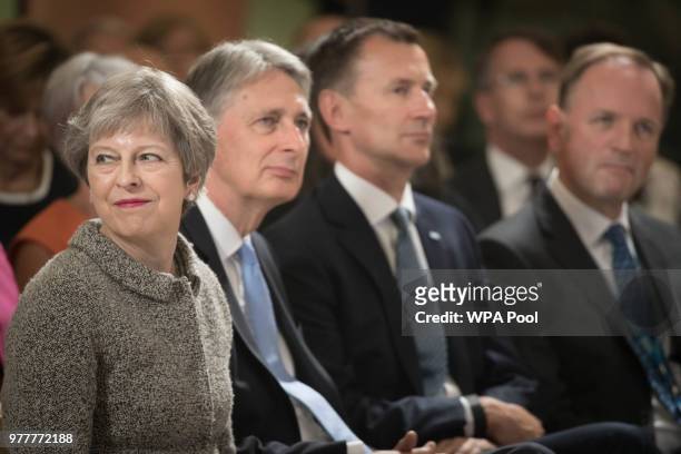 Prime Minister Theresa May looks on as she sits with Chancellor of the Exchequer Philip Hammond, Health Secretary Jeremy Hunt and Chief Executive Of...