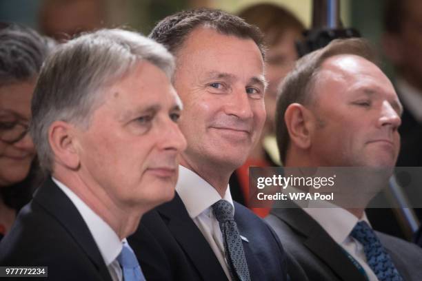 Chancellor of the Exchequer Philip Hammond, Health Secretary Jeremy Hunt and Chief Executive Of NHS England Simon Stevens listen to speakers at the...