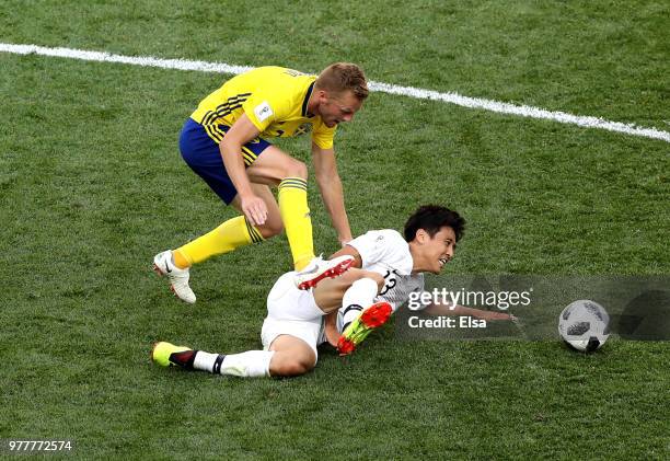 Koo Ja-Cheol of Korea Republic is tackled by Sebastian Larsson of Sweden during the 2018 FIFA World Cup Russia group F match between Sweden and Korea...