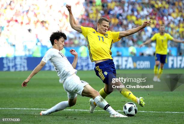 Viktor Claesson of Sweden is tackled by Lee Jae-Sung of Korea Republic during the 2018 FIFA World Cup Russia group F match between Sweden and Korea...