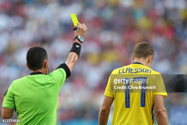 Viktor Claesson of Sweden is shown a yellow card by Referee Joel Aguilar during the 2018 FIFA World Cup Russia group F match between Sweden and Korea...