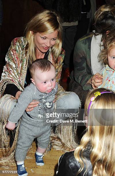 Kate Moss with Flynn Tilbury attend the launch for Stella McCartney's collection for GAP at the Porchester Hall on March 16, 2010 in London, England.