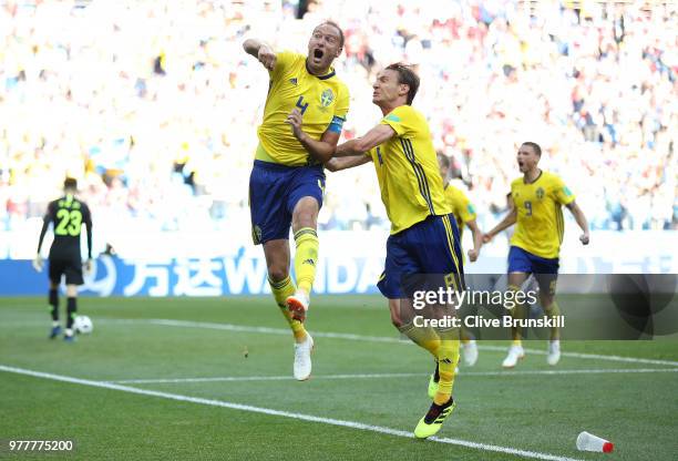 Andreas Granqvist of Sweden celebrates after scoring his team's first goal with team mate Albin Ekdal during the 2018 FIFA World Cup Russia group F...