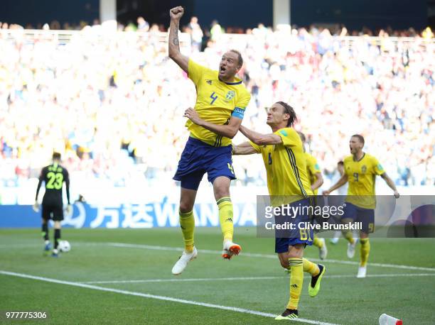 Andreas Granqvist of Sweden celebrates after scoring his team's first goal with team mate Albin Ekdal during the 2018 FIFA World Cup Russia group F...