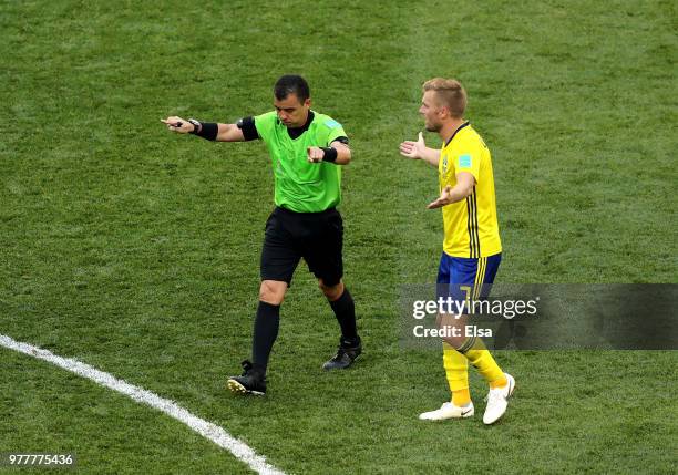 Referee Joel Aguilar indicates a VAR desicion, before awarding Sweden a penalty during the 2018 FIFA World Cup Russia group F match between Sweden...