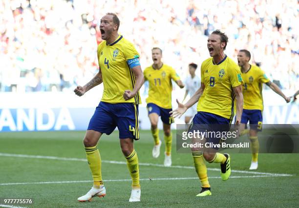 Andreas Granqvist of Sweden celebrates after scoring his team's first goal with team mate Albin Ekdal during the 2018 FIFA World Cup Russia group F...