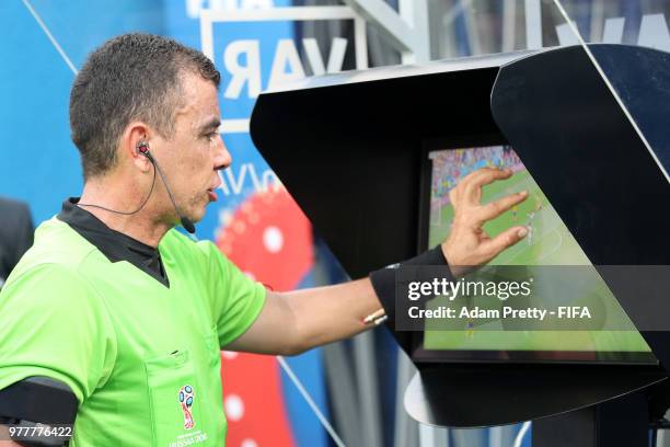 Referee Joel Aguilar reviews the VAR footage, before awarding Sweden a penalty during the 2018 FIFA World Cup Russia group F match between Sweden and...