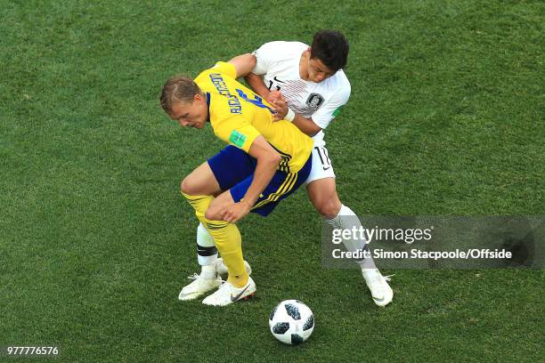 Ludwig Augustinsson of Sweden and Hwang Hee-chan of South Korea battle for the ball during the 2018 FIFA World Cup Russia group F match between...