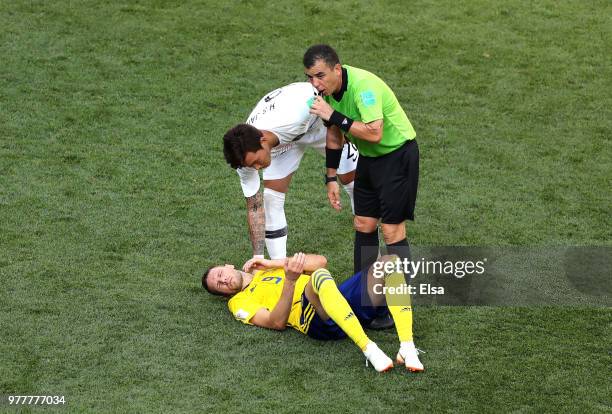 Jang Hyun-Soo of Korea Republic and Referee Joel Aguilar check on codition of Marcus Berg of Sweden as he lies injured during the 2018 FIFA World Cup...