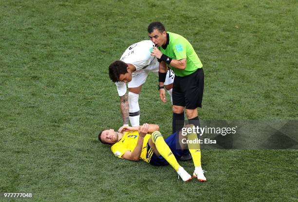 Jang Hyun-Soo of Korea Republic reacts as Marcus Berg of Sweden goes down, whilst Referee Joel Aguilar checks if he is ok during the 2018 FIFA World...