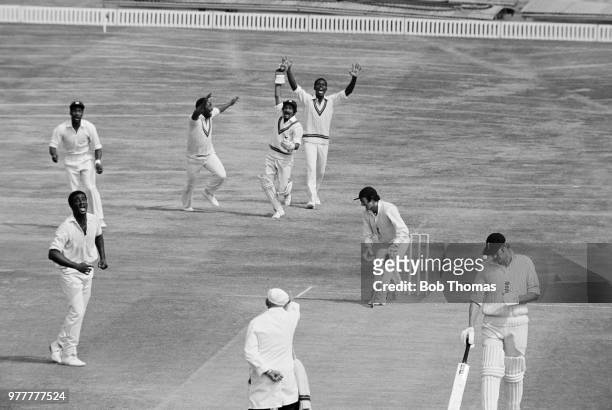 England batsman Alan Knott is caught by West Indies wicketkeeper Deryck Murray off the bowling of Wayne Daniel for 2 runs during the 4th Test match...