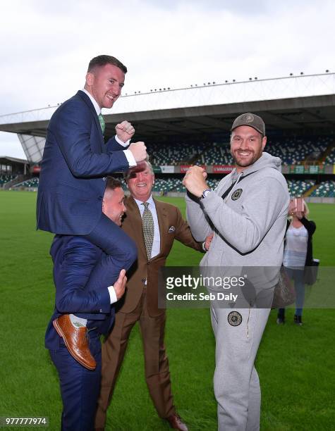 Belfast , United Kingdom - 18 June 2018; Paddy Barnes, left, on the shoulders of Carl Frampton, with Tyson Fury, right, and promoter Frank Warren,...