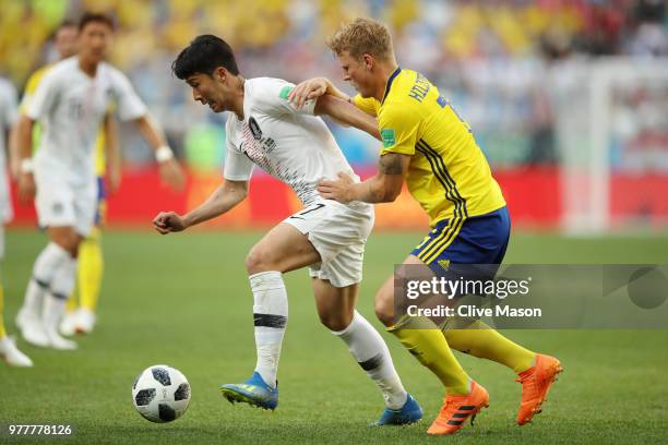 Son Heung-Min of Korea Republic is challenged by Oscar Hiljemark of Sweden during the 2018 FIFA World Cup Russia group F match between Sweden and...