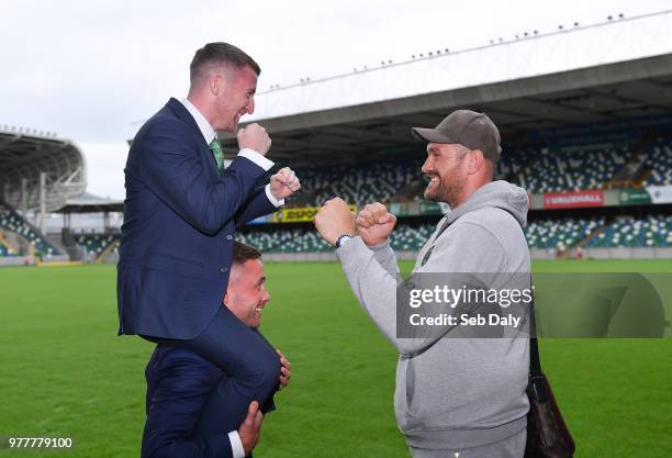 Belfast , United Kingdom - 18 June 2018; Paddy Barnes, left, on the shoulders of Carl Frampton, with Tyson Fury, right, following a press conference...