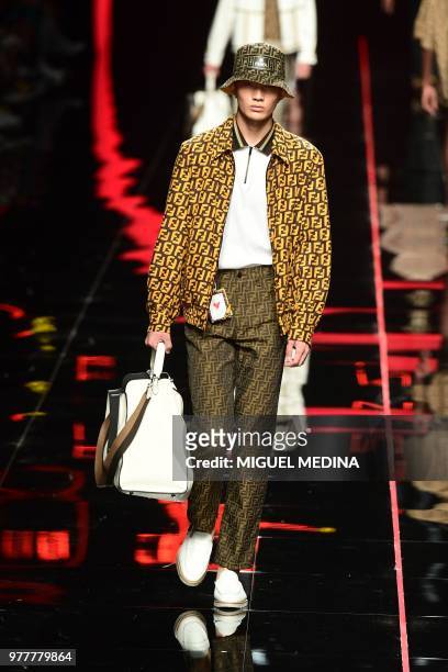 Model presents a creation by Fendi during the men & women's spring/summer 2019 collection fashion show in Milan, on June 18, 2018.