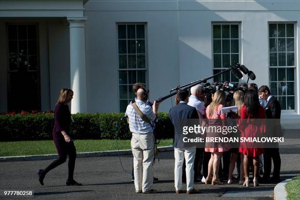 White House Deputy Press Secretary Hogan Gidley speaks to reporters outside the White House's West Wing about the process of separating parents and...