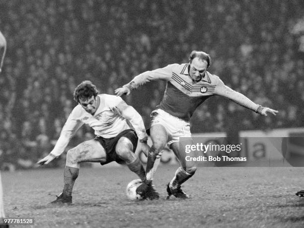 Ian Callaghan of Liverpool and Bryan Robson of West Ham United battle for the ball during a Football League Division One match at Upton Park on...