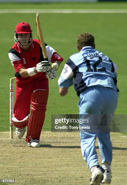 Bowler Simon Cook catches Jeff Vaughan off his own bowling for 4 in the Mercantile Mutual Cup match between South Australia and New South Wales held...