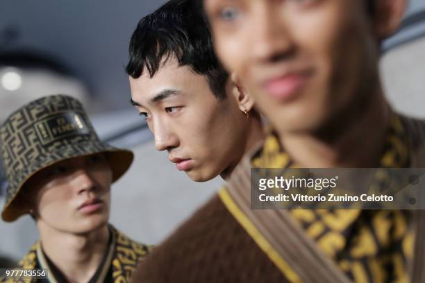 Models are seen backstage ahead of the Fendi show during Milan Men's Fashion Week Spring/Summer 2019 on June 18, 2018 in Milan, Italy.