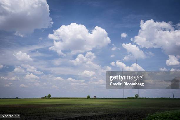 Data transmission towers stand in a field in Maple Park, Illinois, U.S., on Friday, May 25, 2018. In Maple Park, Illinois, traders appear to be...