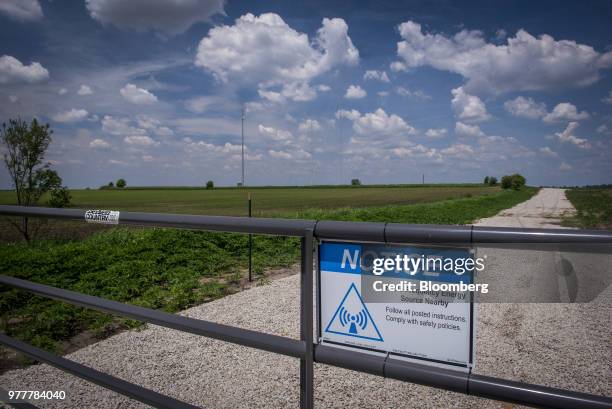 Sign near data transmission towers notes the presence of radio frequency energy nearby in Maple Park, Illinois, U.S., on Friday, May 25, 2018. In...