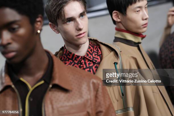 Models are seen backstage ahead of the Fendi show during Milan Men's Fashion Week Spring/Summer 2019 on June 18, 2018 in Milan, Italy.