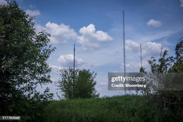 Data transmission towers stand in a field in Maple Park, Illinois, U.S., on Friday, May 25, 2018. In Maple Park, Illinois, traders appear to be...