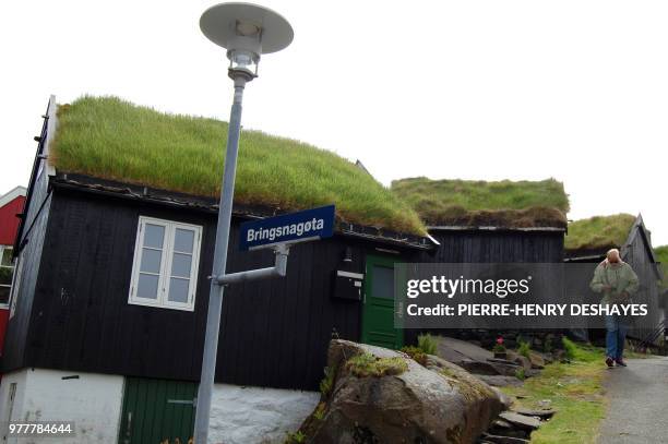 Picture taken on June 4, 2018 shows old houses with vegetal roofs in the old city of Torshavn, on the Streymoy Island, the largest of Faroe Islands...