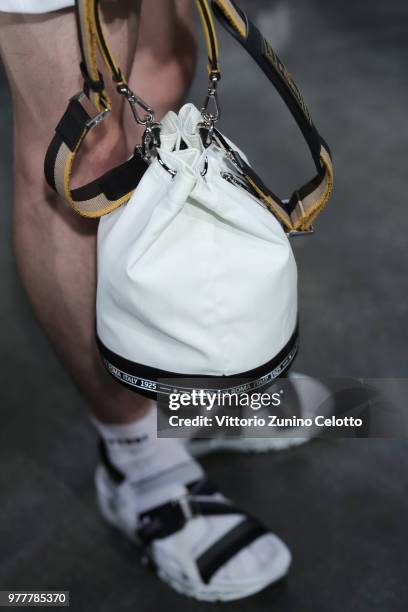 Model, bag detail, is seen backstage ahead of the Fendi show during Milan Men's Fashion Week Spring/Summer 2019 on June 18, 2018 in Milan, Italy.