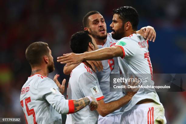 Diego Costa of Spain celebrates with team mates after scoring his team's second goal during the 2018 FIFA World Cup Russia group B match between...