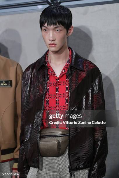 Model is seen backstage ahead of the Fendi show during Milan Men's Fashion Week Spring/Summer 2019 on June 18, 2018 in Milan, Italy.